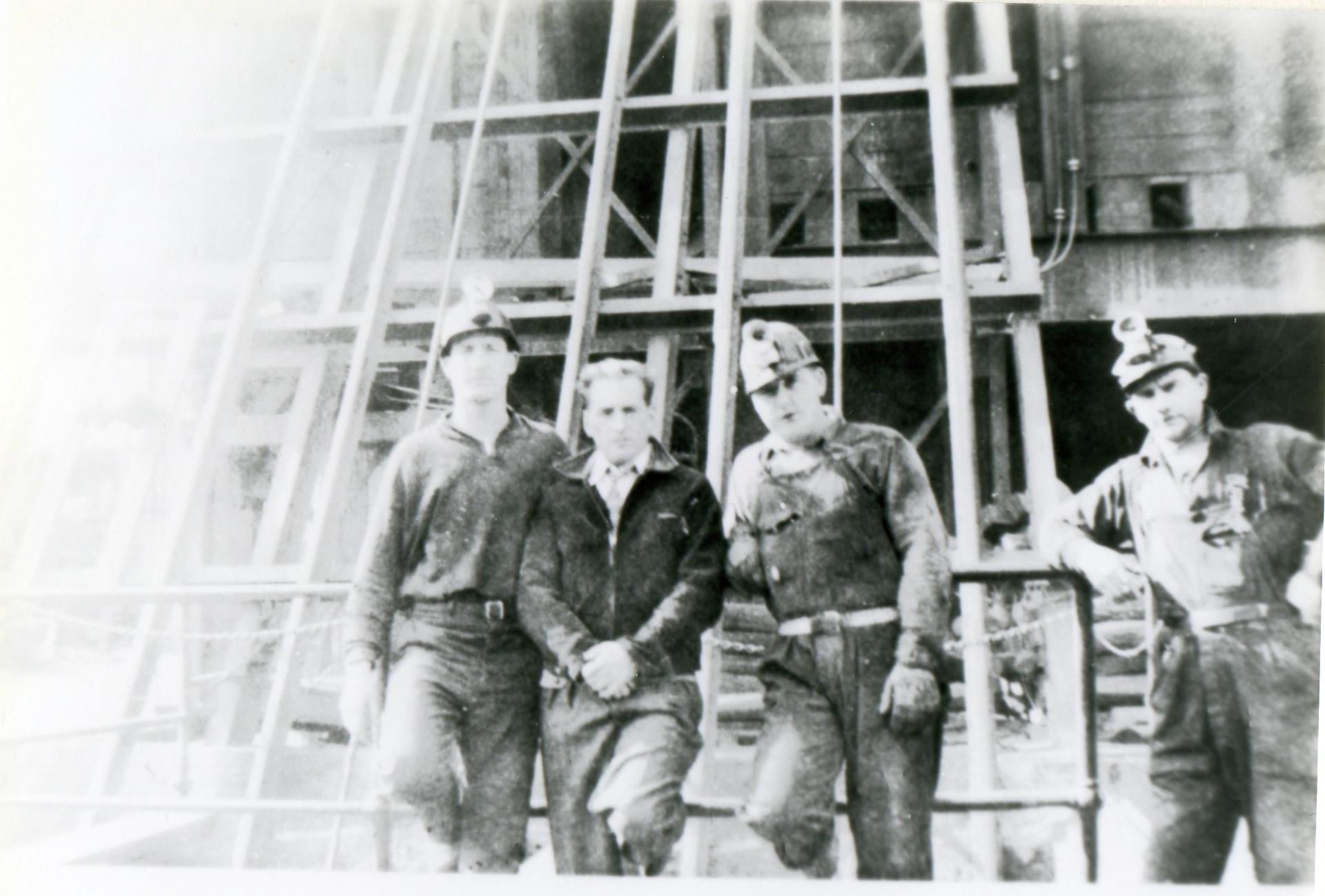 Washington Mine #2 Shaft behind workers and hoist